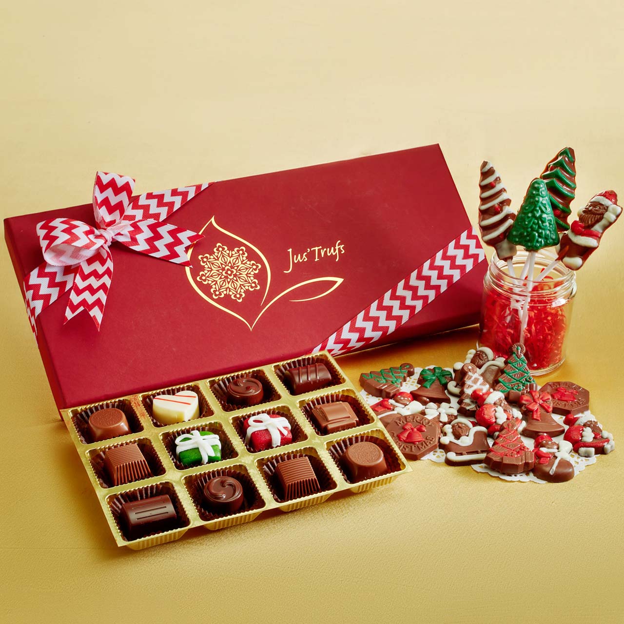 Christmas gift box with chocolates and chocolate lollipops by Jus